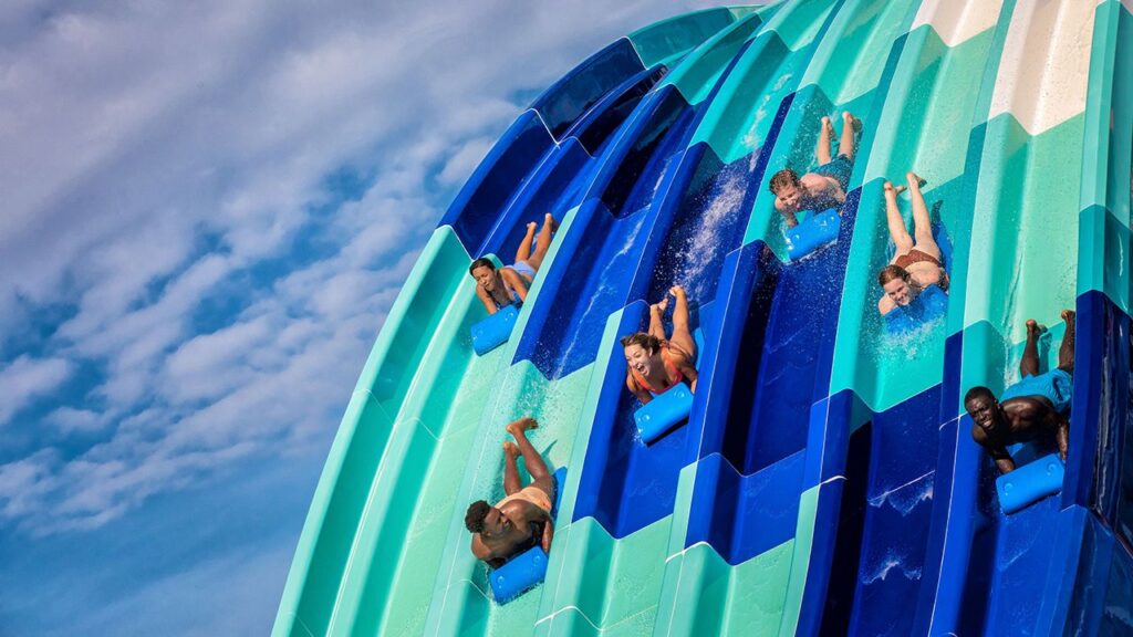 People riding the Reply Racers water slide at Island H2O Water Park
