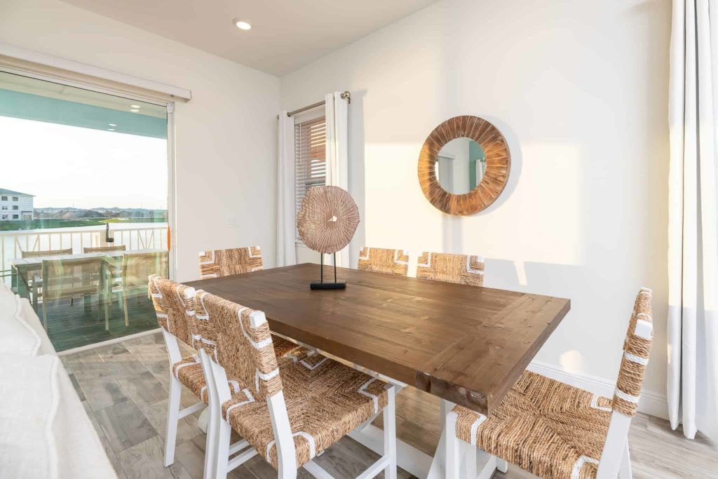 Dining room with island-inspired decorative centerpiece: 3 Bedroom Waters Edge Cottage