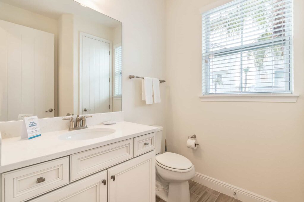 4 Bedroom Premium Cottage half bathroom with sink and toilet