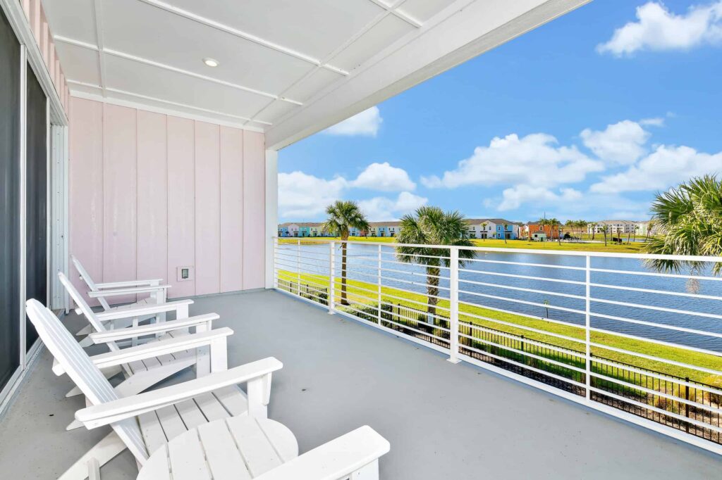 Covered balcony overlooking Margaritaville Cottages Orlando waterfront: 6 Bedroom Cottage