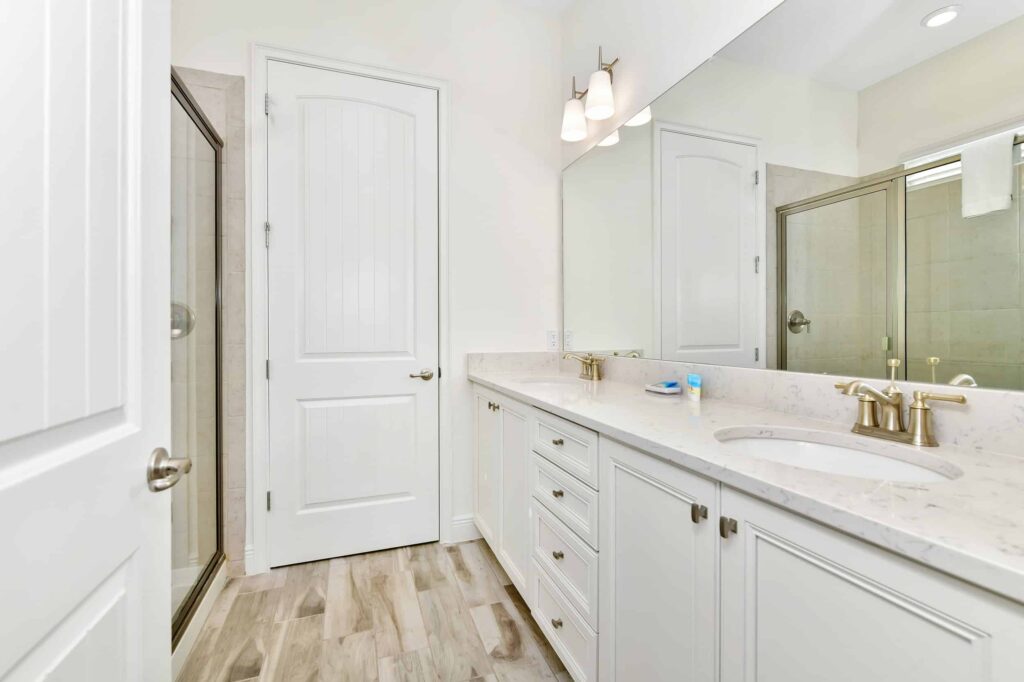 Bathroom 5 with double sinks and walk-in shower: 6 Bedroom Cottage