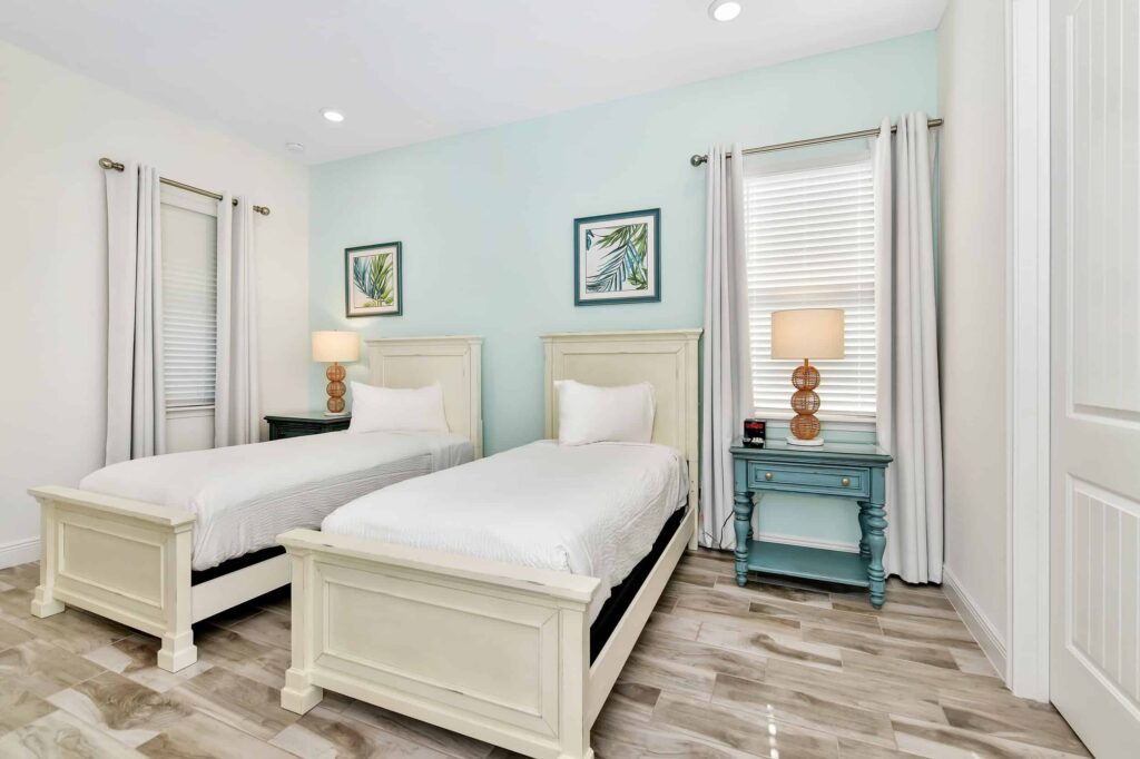 Bedroom 3 with twin single beds and side tables: 6 Bedroom Cottage