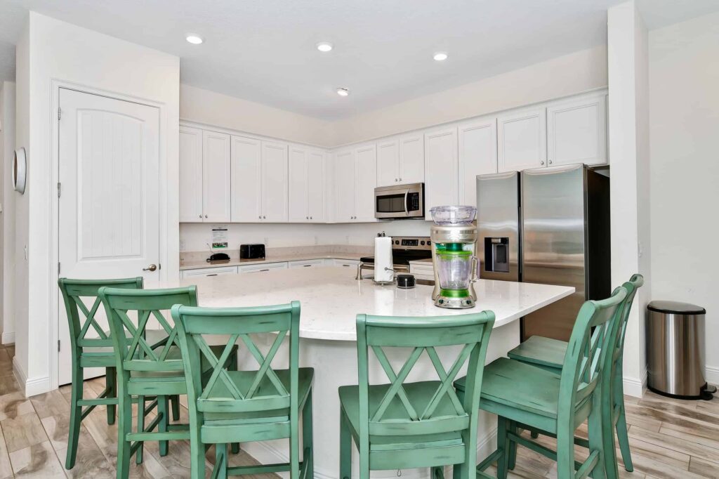 Fully equipped kitchen highlighting island with barstool seating: 6 Bedroom Cottage