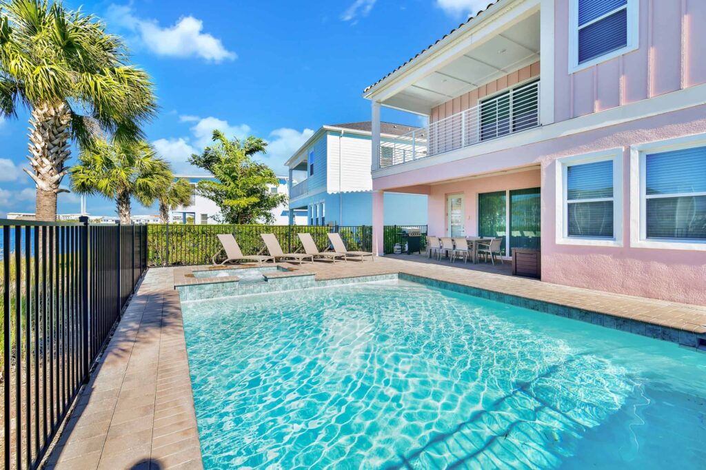 Private backyard with pool, covered lanai, and covered balcony: 6 Bedroom Cottage