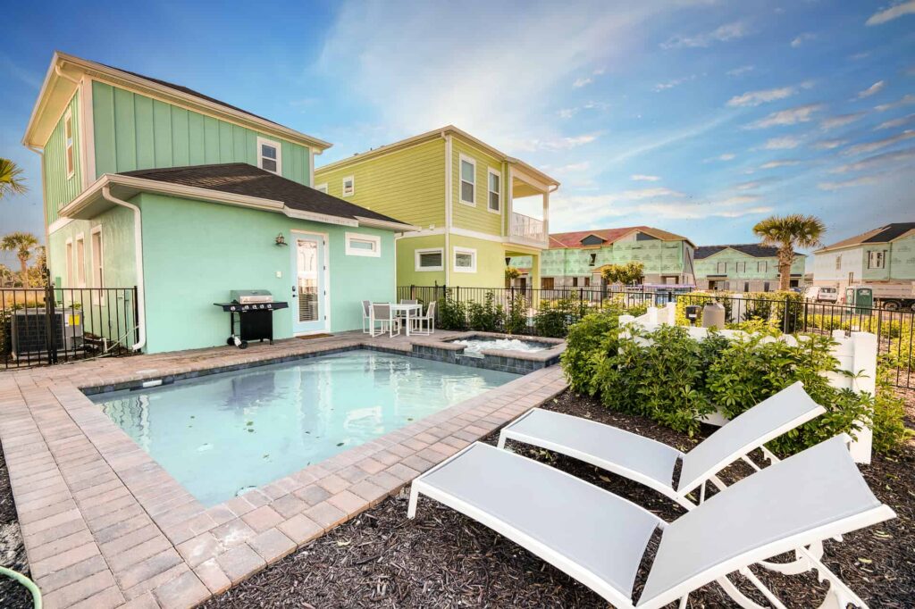 Private backyard with sun loungers, pool, and hot tub: 2 Bedroom Elite Cottage