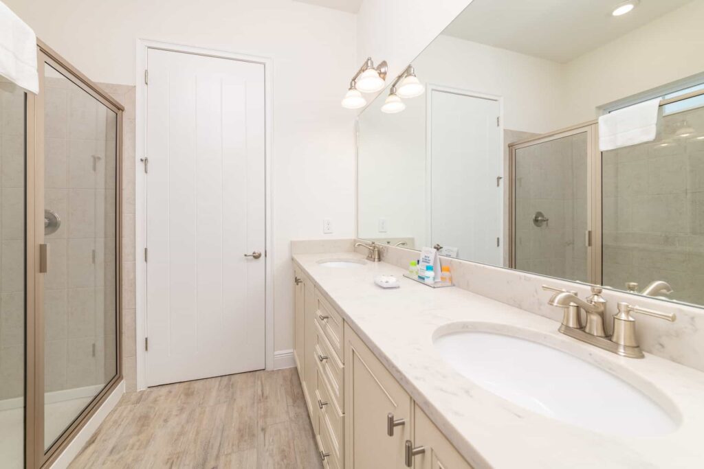 Bathroom 5 with double sinks and walk-in shower: 6 Bedroom Elite Cottage