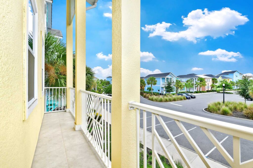Covered front balcony overlooking Margaritaville Resort Orlando surrounding Cottages: 7 Bedroom Cottage