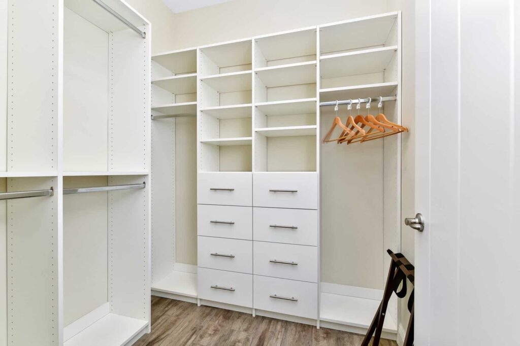 Large walk-in closet with multiple shelves and drawers: 7 Bedroom Cottage