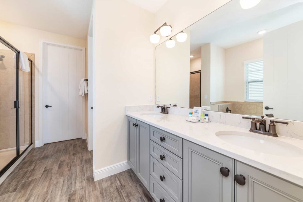 Bathroom 8 with double sinks and walk-in shower: 7 Bedroom Elite Cottage