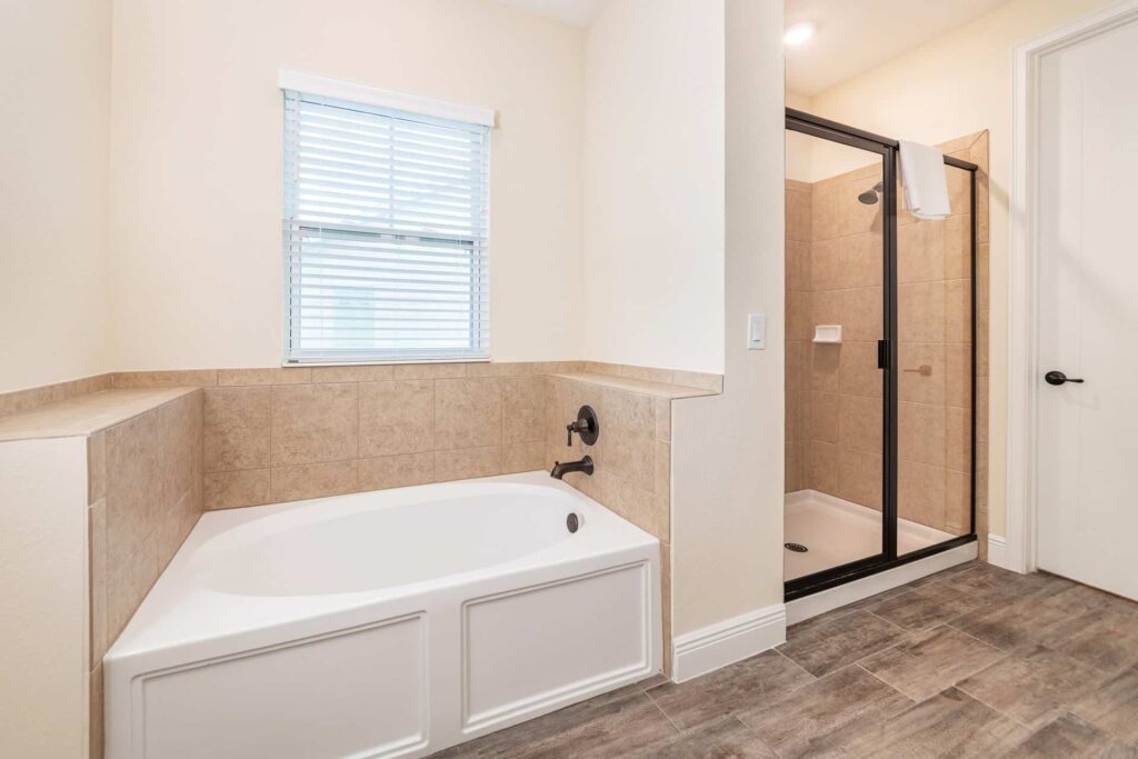 Bathroom 8 with walk-in shower and separate bathtub: 7 Bedroom Elite Cottage
