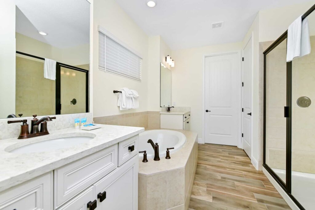 Bathroom 7 with walk-in shower and separate bathtub: 8 Bedroom Cottage