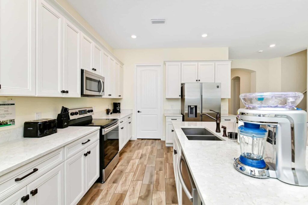 Full kitchen with island counter and Margaritaville Frozen Concoction Maker: 8 Bedroom Cottage