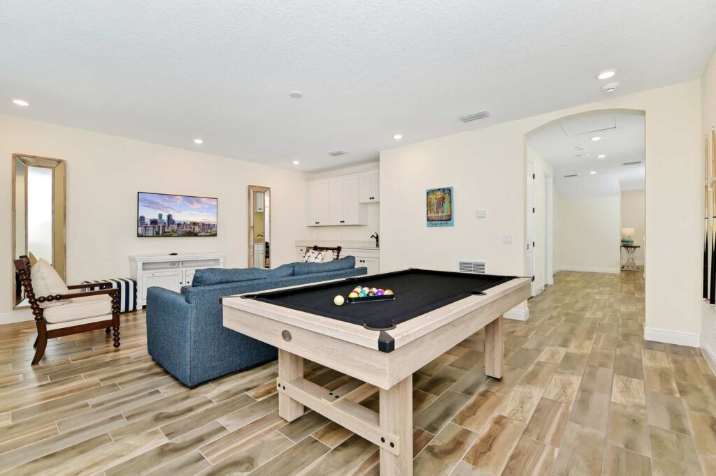 Loft room with pool table and wall-mounted TV: 8 Bedroom Cottage