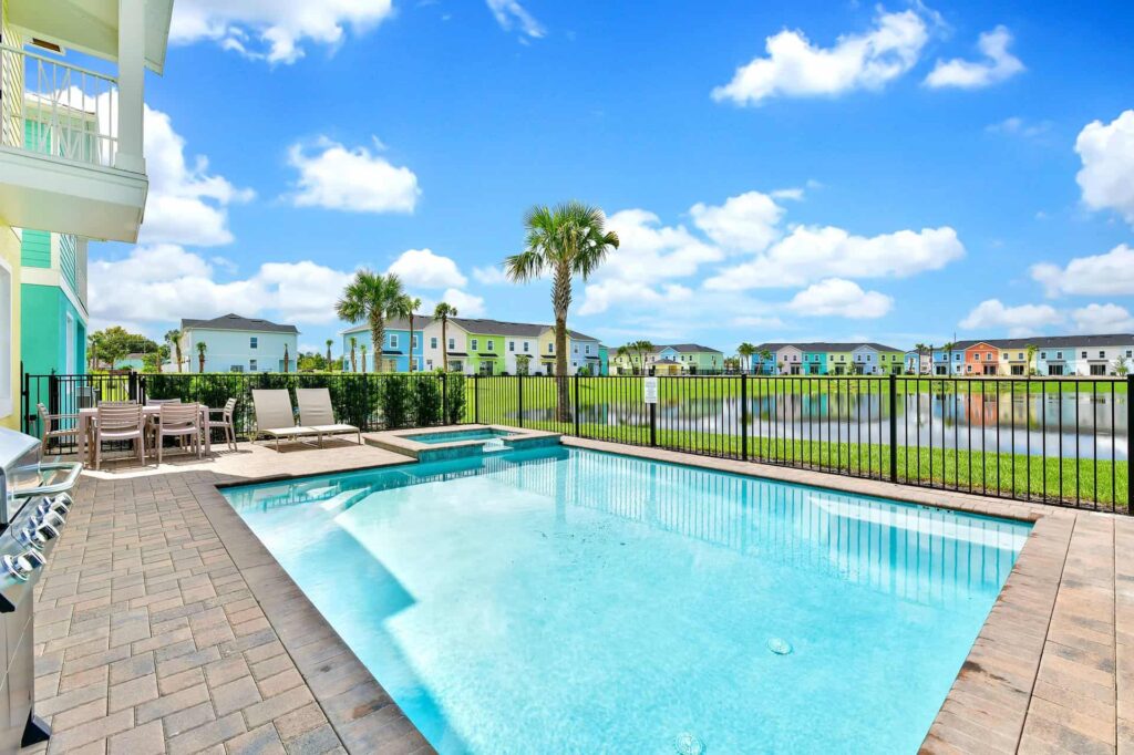 Private backyard pool overlooking Margaritaville Resort Orlando Cottages waterfront: 8 Bedroom Cottage