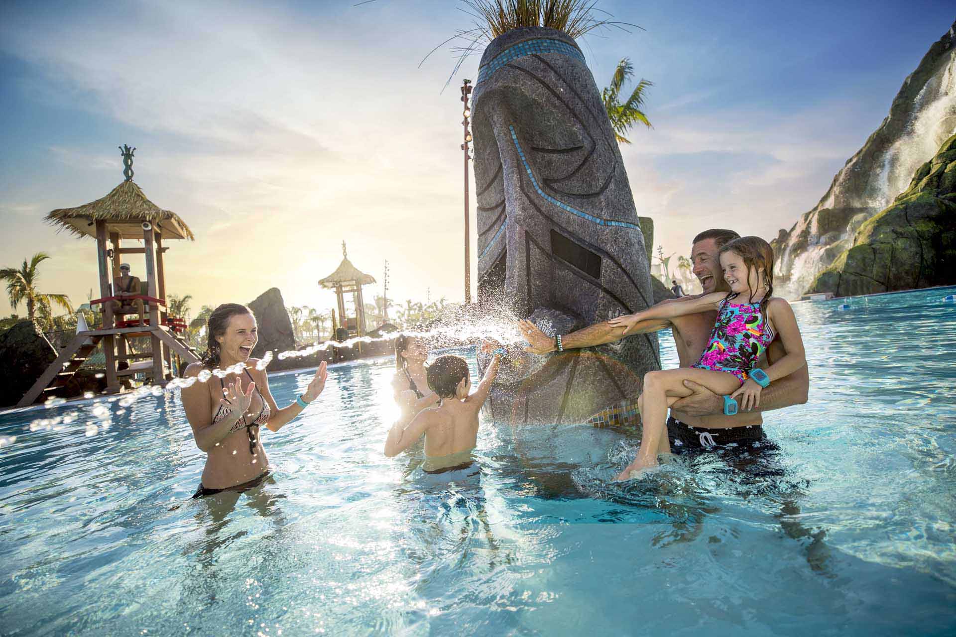 Family playing in the Reef Pool at Universal's Volcano Bay