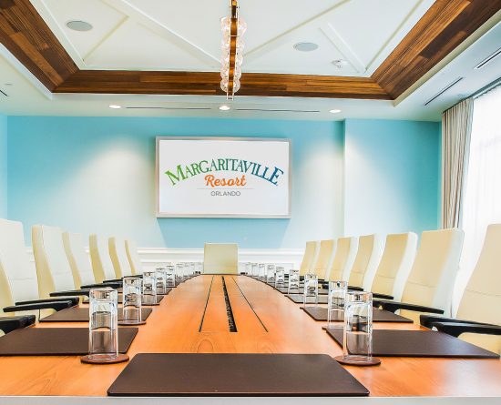 Meeting space with long conference table at Margaritaville Resort Orlando.